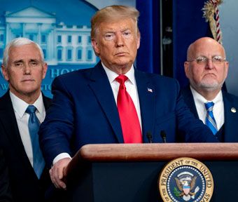 Mike Pence and Robert Redfield flank Donad Trump