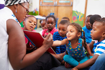 Teacher reading to children