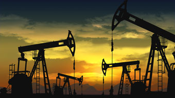 Oil rigs in sunrise