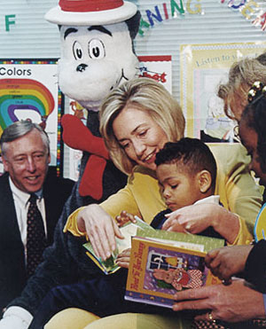 Hillary Clinton reading to a child