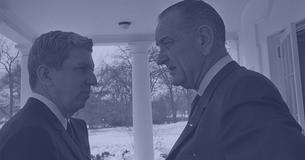Douglass Cater and President Lyndon B. Johnson talking to each other, snow on the ground in bkg