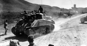 Chinese and U.S. Army manned tanks patrol the Burma Road.