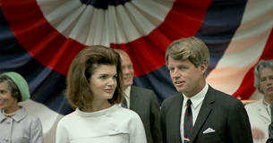 Jackie Kennedy and Bobby Kennedy standing next to each other