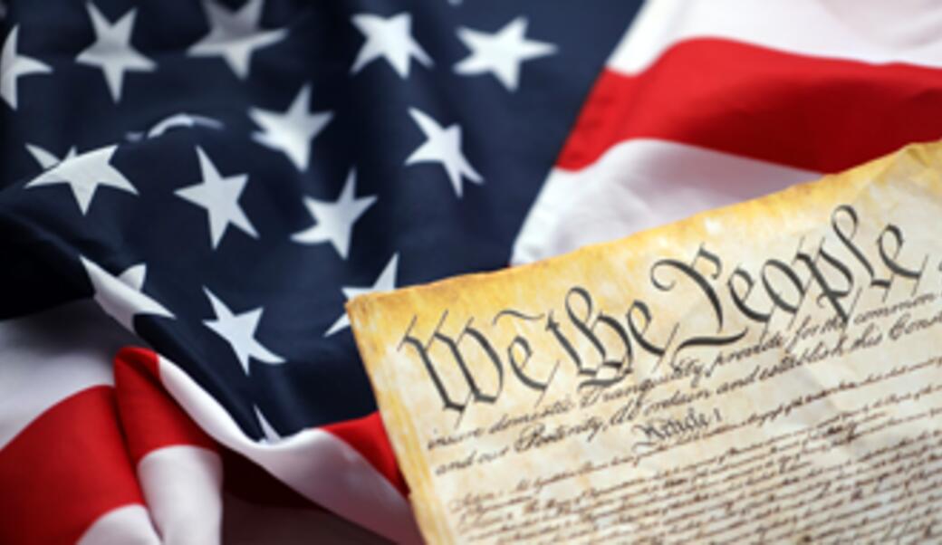 constitution on top of american flag