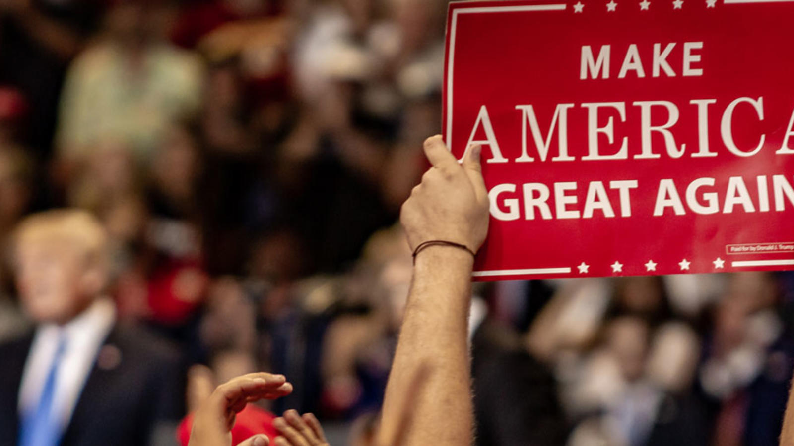 Trump rally with "Make America Great Again" sign