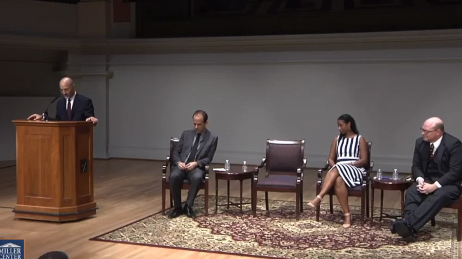 group sitting on a stage talking