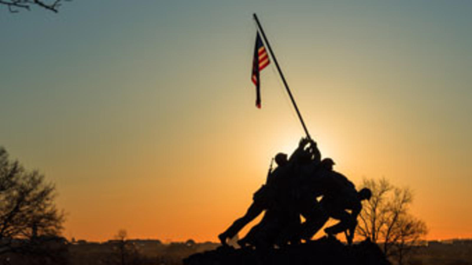 soldiers raising the american flag